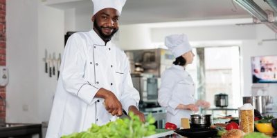 confident-head-chef-restaurant-professional-kitchen-cutting-vegetables-preparing-garnish-dinner-dish-recipe-gastronomy-expert-cooking-delicious-organic-food-using-fresh-ingredients_482257-40125